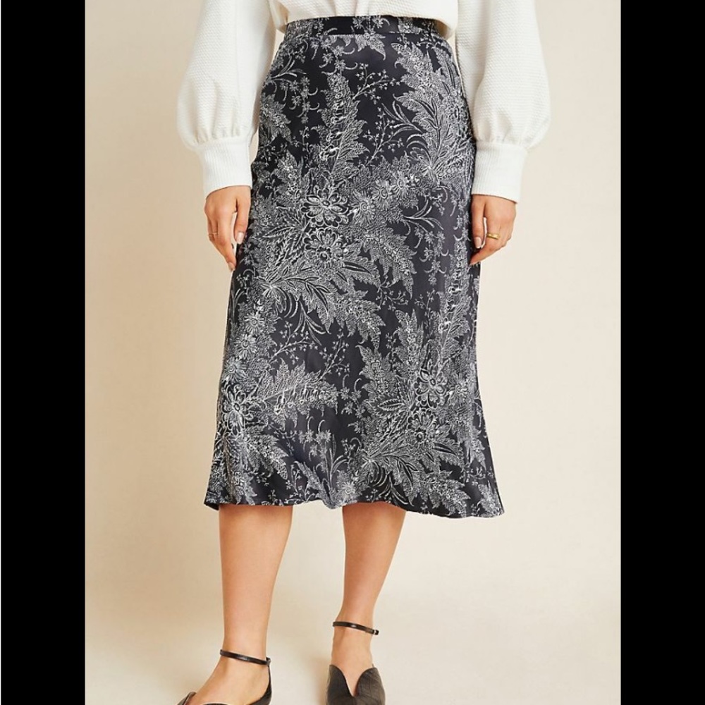 Gorgeous Anthropologie silk midi skirt with a black and white floral design